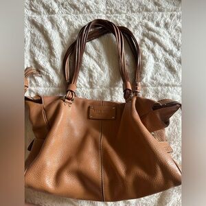 Brown Kate spade bag.